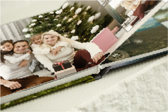 Authory homepage image of a layflat photobook with a photo of a happy family